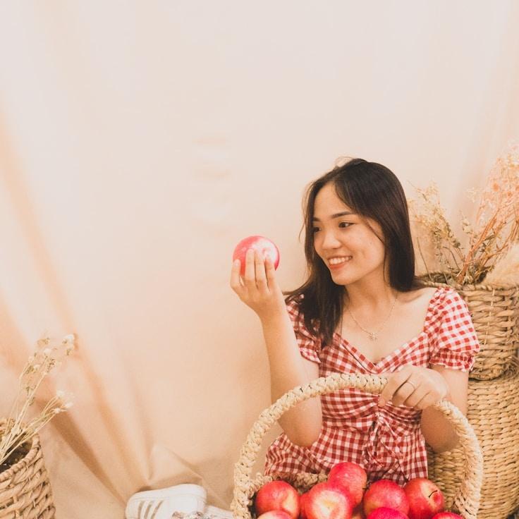 Avery Smith, Lead Design Curator at Glimmer Ridge Folio, reviewing corporate floral arrangements